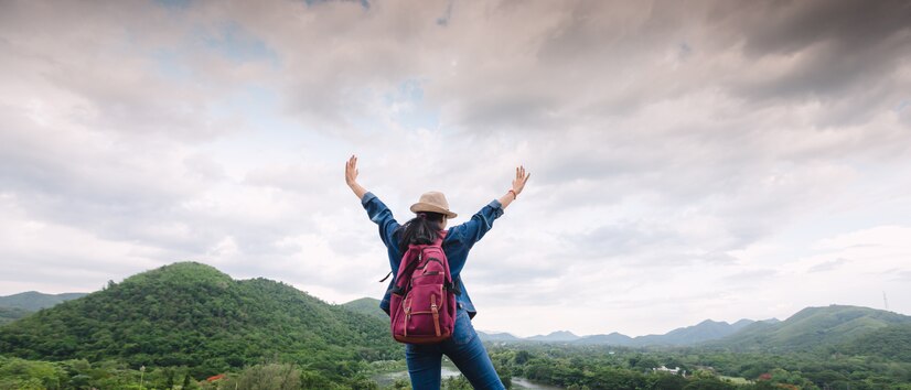 happy-young-asian-girl-kang-kra-chan-national-park-thailand_38810-6531